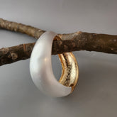 Dual tone broad cuff